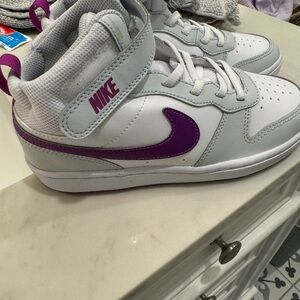 Girls Nike high tops size 2.5- there is a little scuff but never been worn.